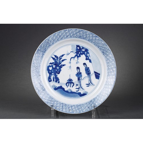 Chinese blue and white porcelain plate with two long Eliza in a garden in front of a censer